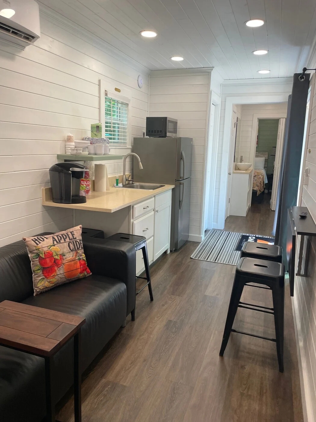 Happy cabin living area with kitchenette and dining counter