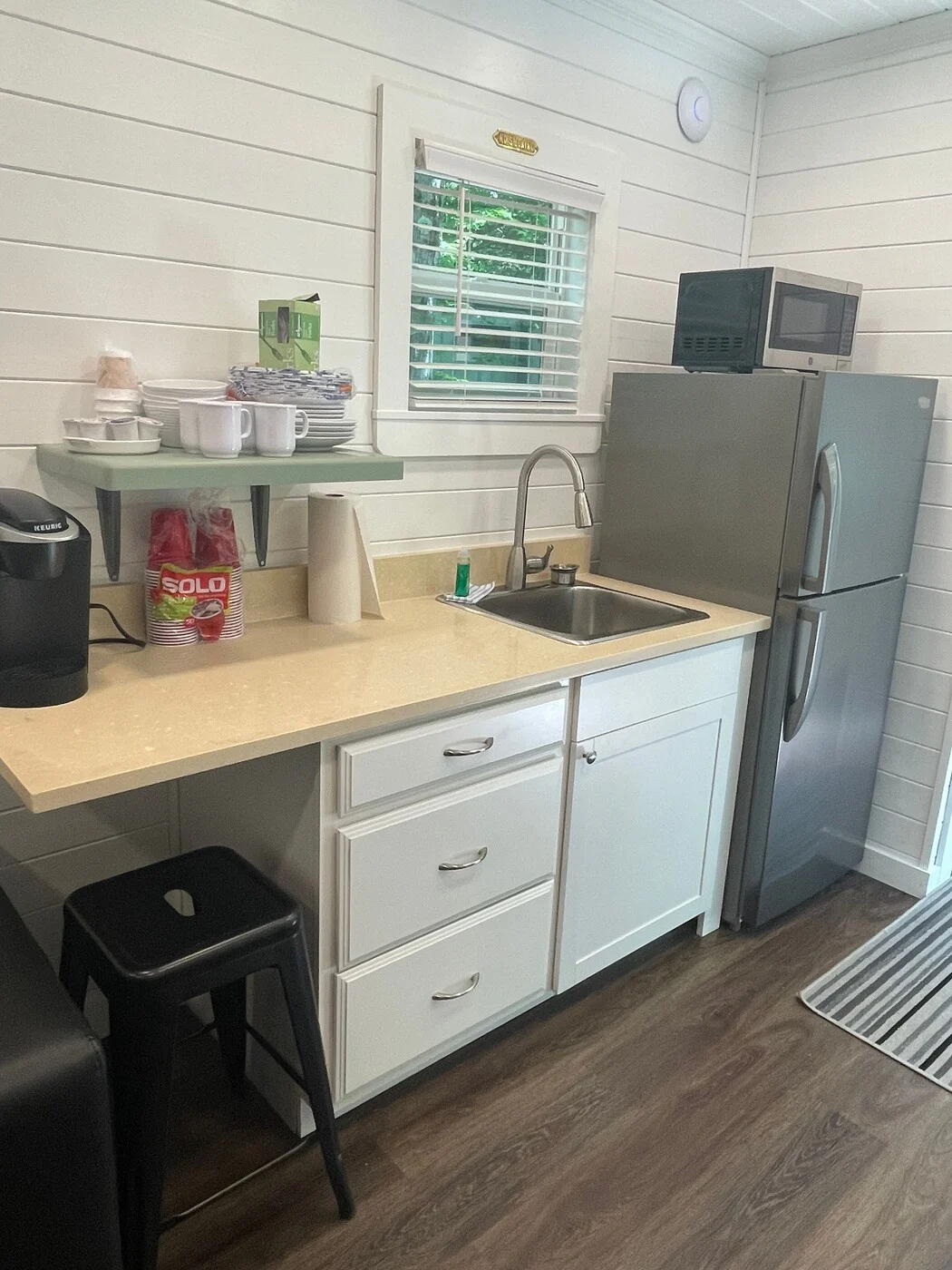 Happy cabin kitchenette with refrigerator and coffee maker