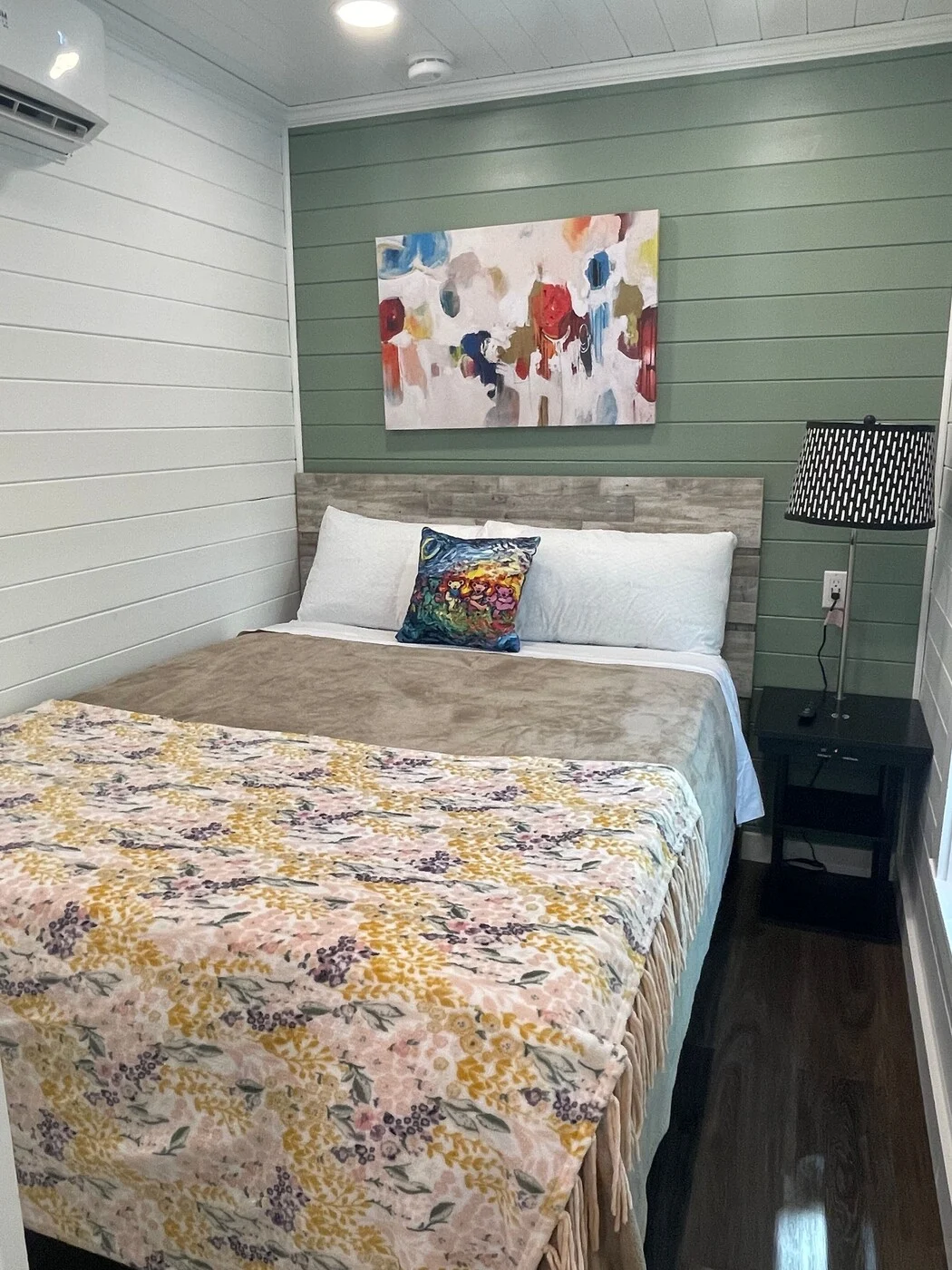 Happy cabin primary bedroom with a queen bed