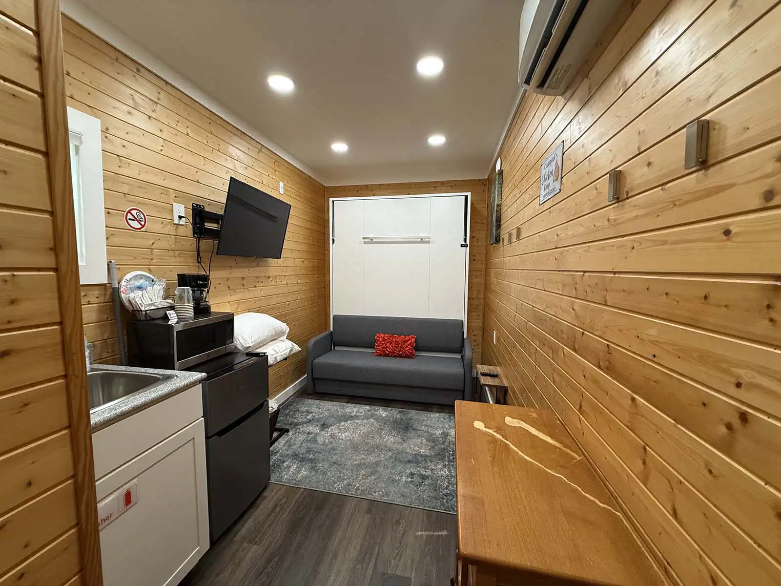 Deer Xing studio interior with kitchenette and seating area