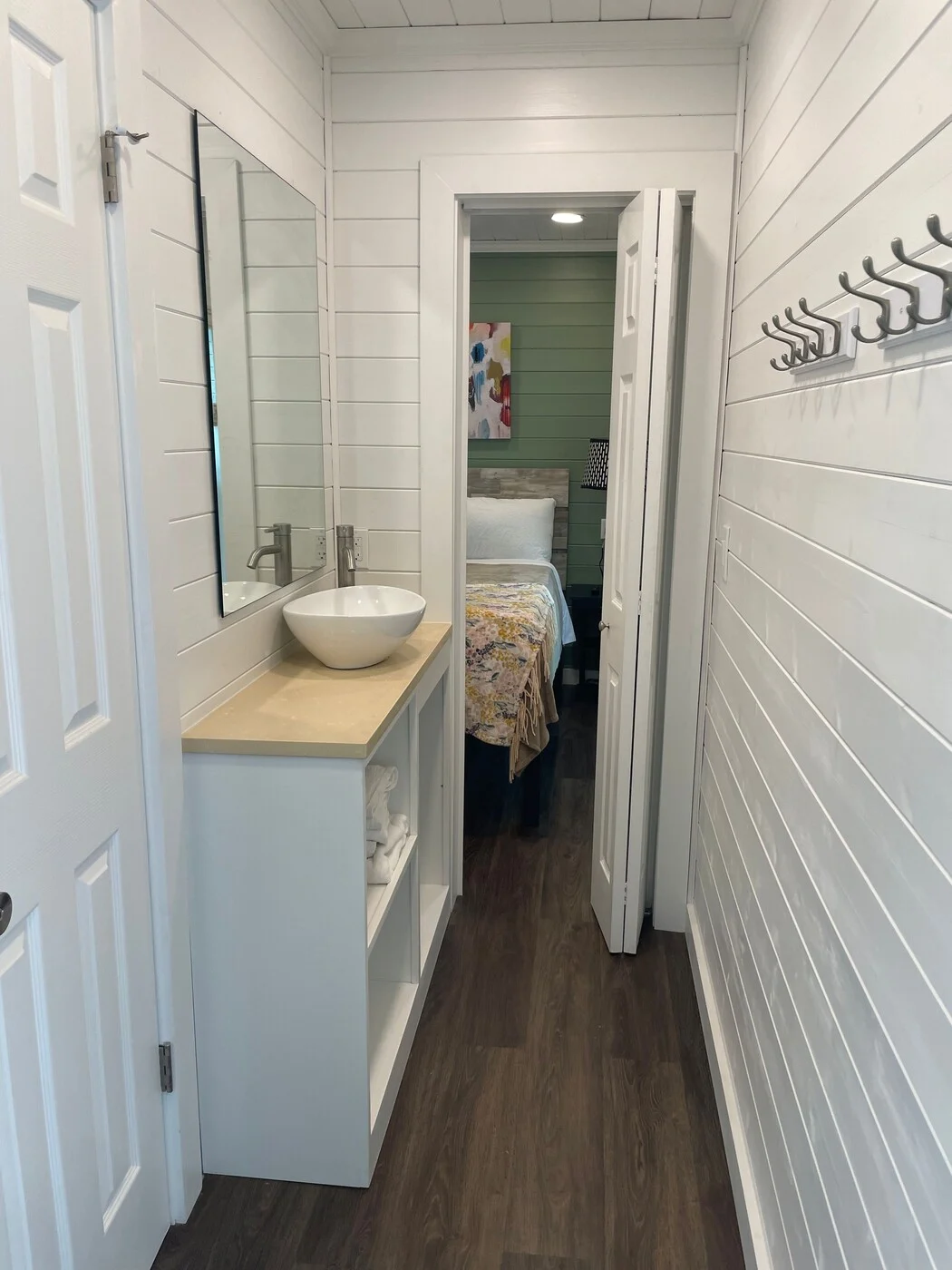 Happy cabin bathroom vanity and hallway