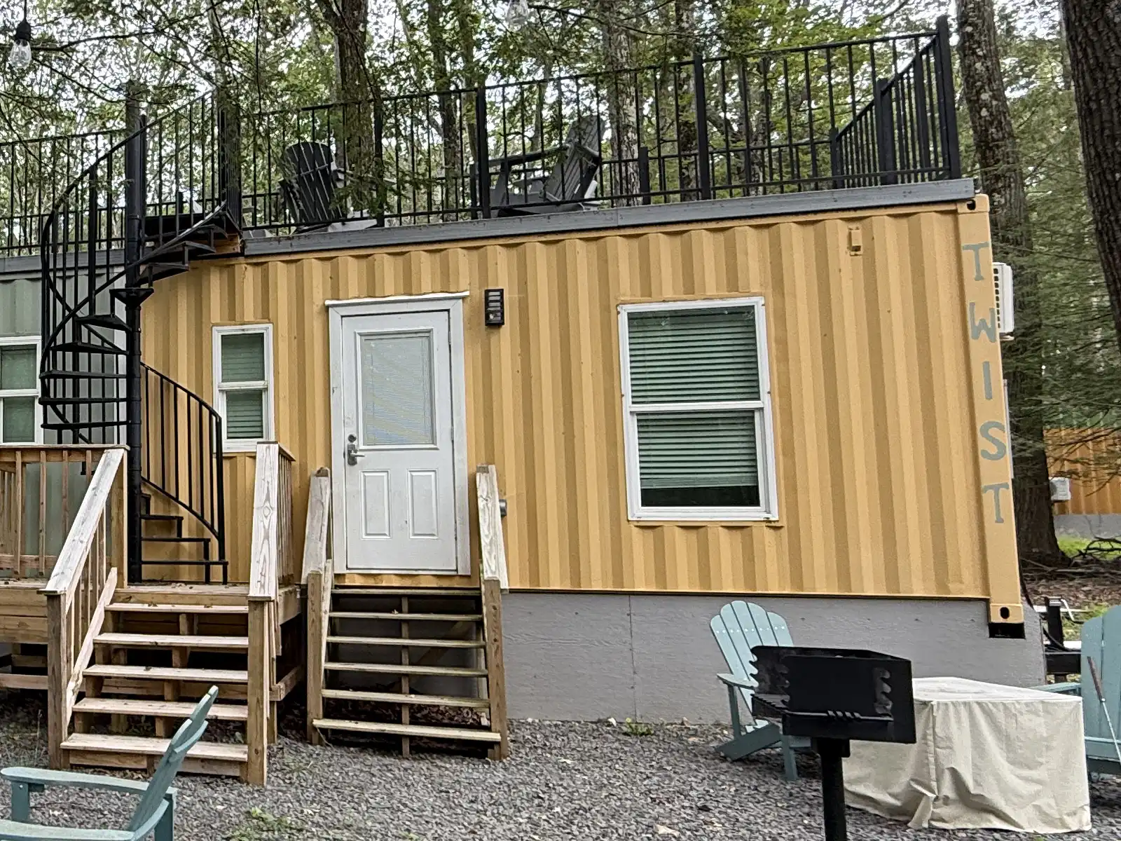 Twist studio cabin exterior with entry steps and rooftop deck access